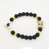 Black Lava/Gold Cross Rhinestone Skull